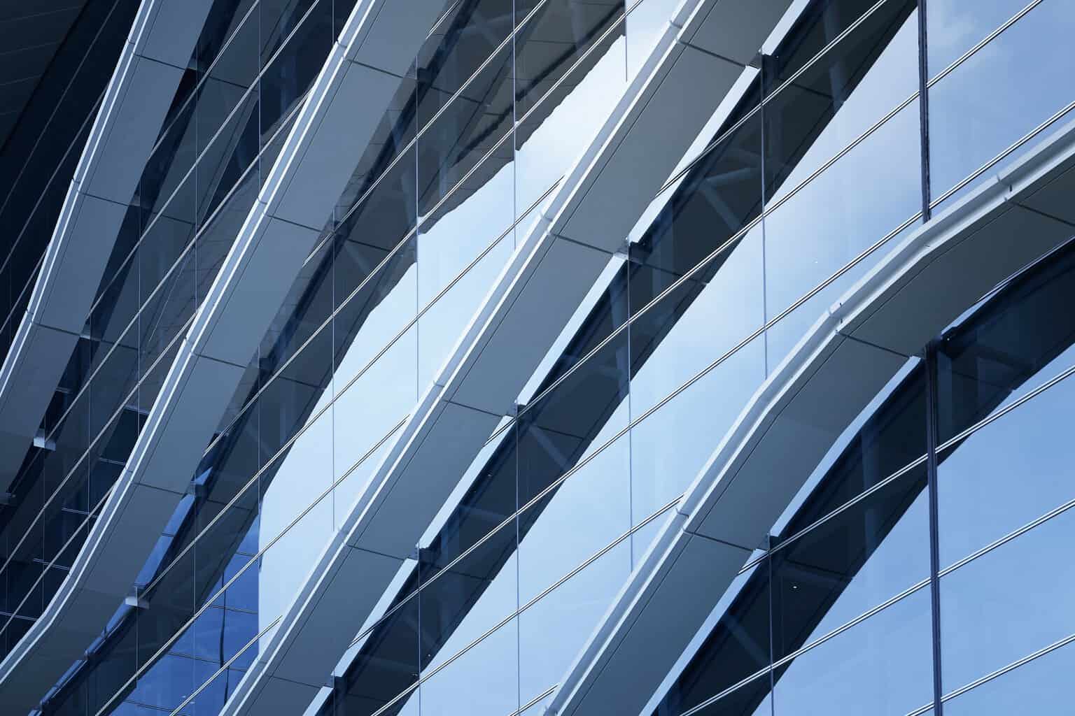 Abstract steel and glass facade detail background of high rise commercial building .Business or industrial successful concept background .